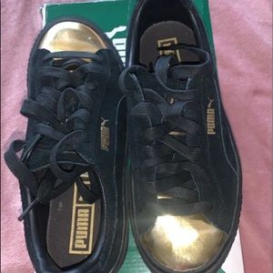 Black and gold Puma